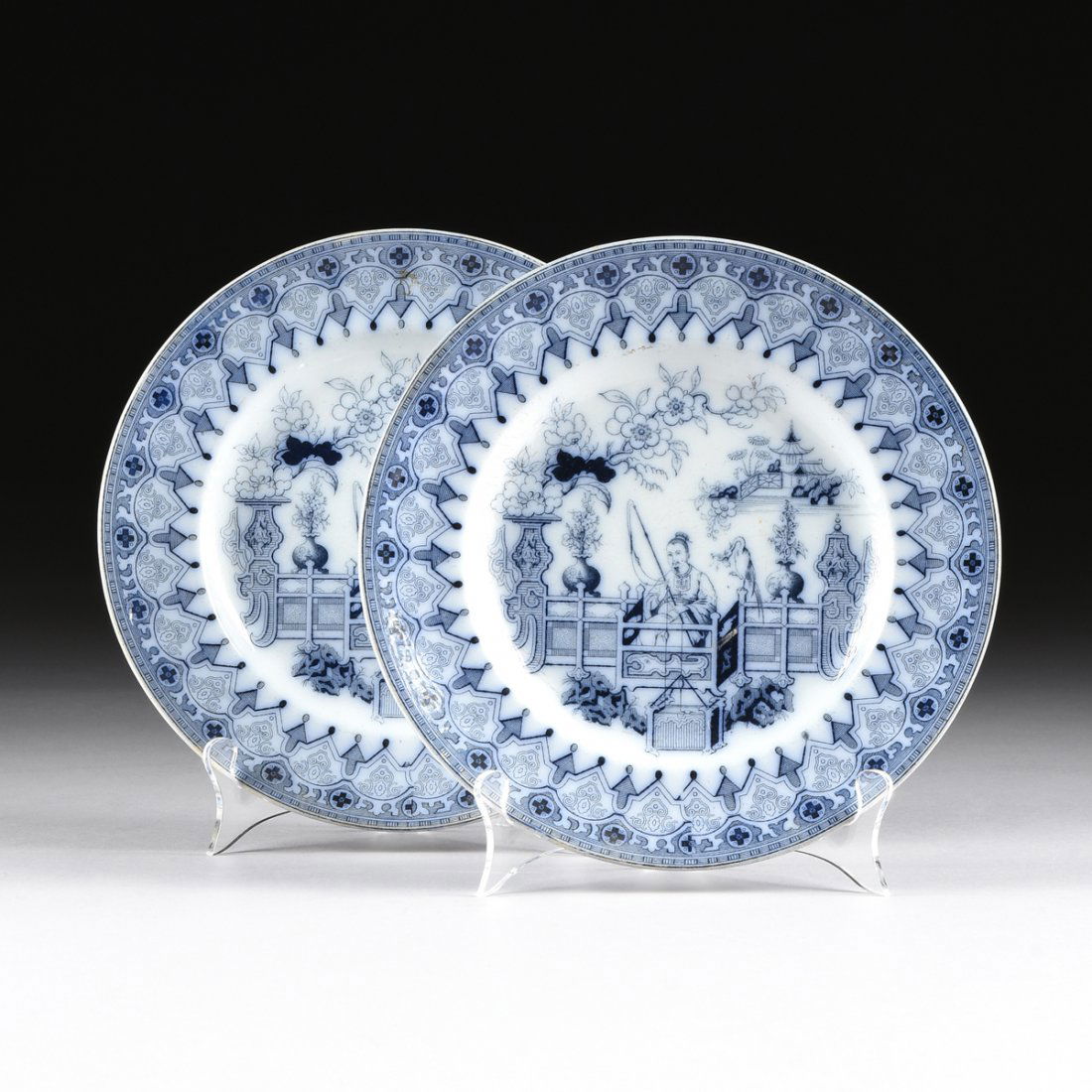 TWO BLUE AND WHITE CERAMIC PLATES, WITH IMPRESSED: TWO BLUE AND WHITE CERAMIC PLATES, WITH IMPRESSED MARKS, both plates in circular form centering a seated man in traditional robes with a fishing pole cast out, the rim detailed in a scalloped design r
