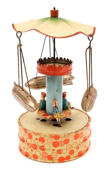 A rare clockwork tinplate Chair-O-Plane style: A rare clockwork tinplate Chair-O-Plane style airship/Zeppelin toy. 16cm high. An Edwardian tinplate toy probably produced in Germany in the form of a funfair ride, with circular motion where the spee