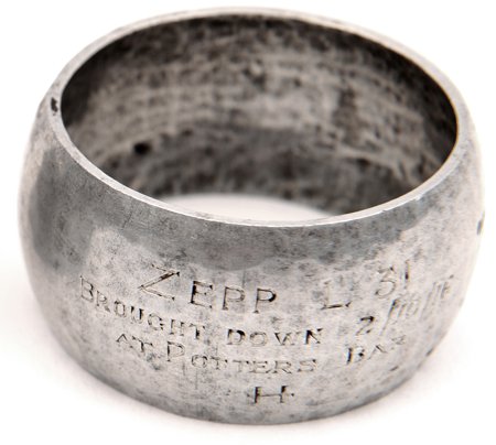 L31 Commemorative Napkin Ring. Aluminium alloy napkin: L31 Commemorative Napkin Ring. Aluminium alloy napkin ring, more heavily worked than other similar souvenirs, to give a more rounded, hammered finish. To the front is engraved in 4 lines “Zepp L31, 