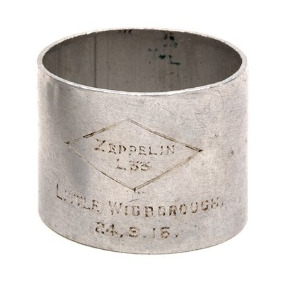 Destruction of L33 – Souvenir Napkin Ring. Aluminium: Destruction of L33 – Souvenir Napkin Ring. Aluminium alloy Napkin Ring (5cm diameter, 4cm high). To the front of the piece is engraved “Zeppelin L33” in a diamond shaped frame, below which is ��