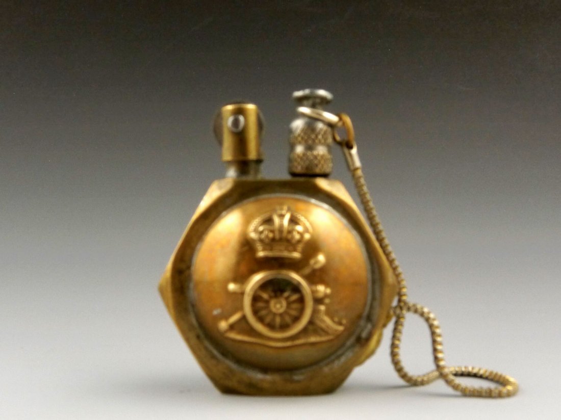 VINTAGE ANTIQUE TRENCH ART LIGHTER WITH COPPER SIDES: This nut lighter is very well built. It has a small chain that attaches to the body of the lighter and the snuffer cap to prevent loss. Looks like it worked very well! The sides are made of copper, th