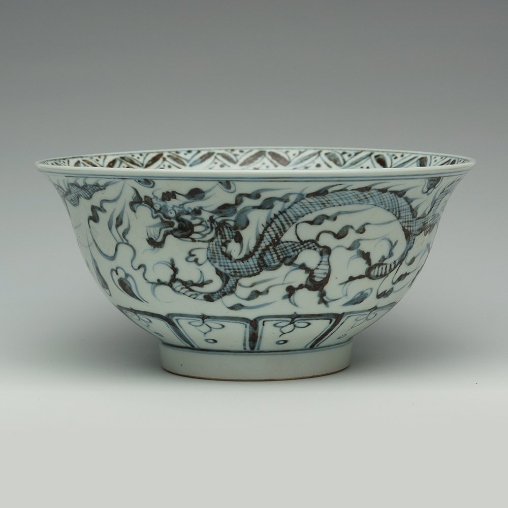 BLUE AND WHITE BOWL WITH DRAGONS: The blue and white decoration includes many spots of dark brown and black. The surface is painted with dragons. H:4" D:8"