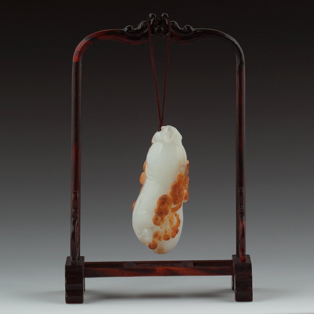 CHINESE XINJIANG SUET WHITE JADE PENDANT: 100% Chinese carved Xinjiang suet white jade pendant, with natural skin and ruyi design. Suet white jade with its white, fine and tender, like coagulate fat wait for a characteristic, is known as neph