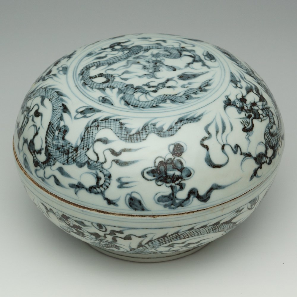 VINTAGE CHINESE BLUE AND WHITE BOWL WITH COVER: The blue and white decoration includes many spots of dark brown and black. The surface is painted with dragons. H:4.5". D:7"