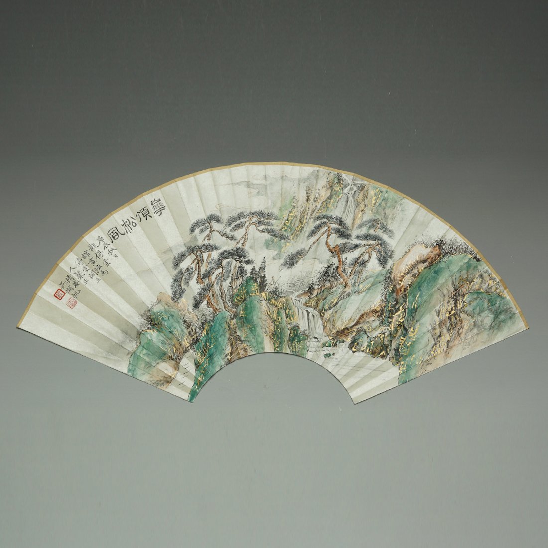 CHINESE LANDSCAPE FAN FACE PAINTING: Chinese ink and colors painting on paper fan face; depicting a landscape with figure, mountainside and trees; signed, inscription and two seal marks. Dimension: 21 x 8 "