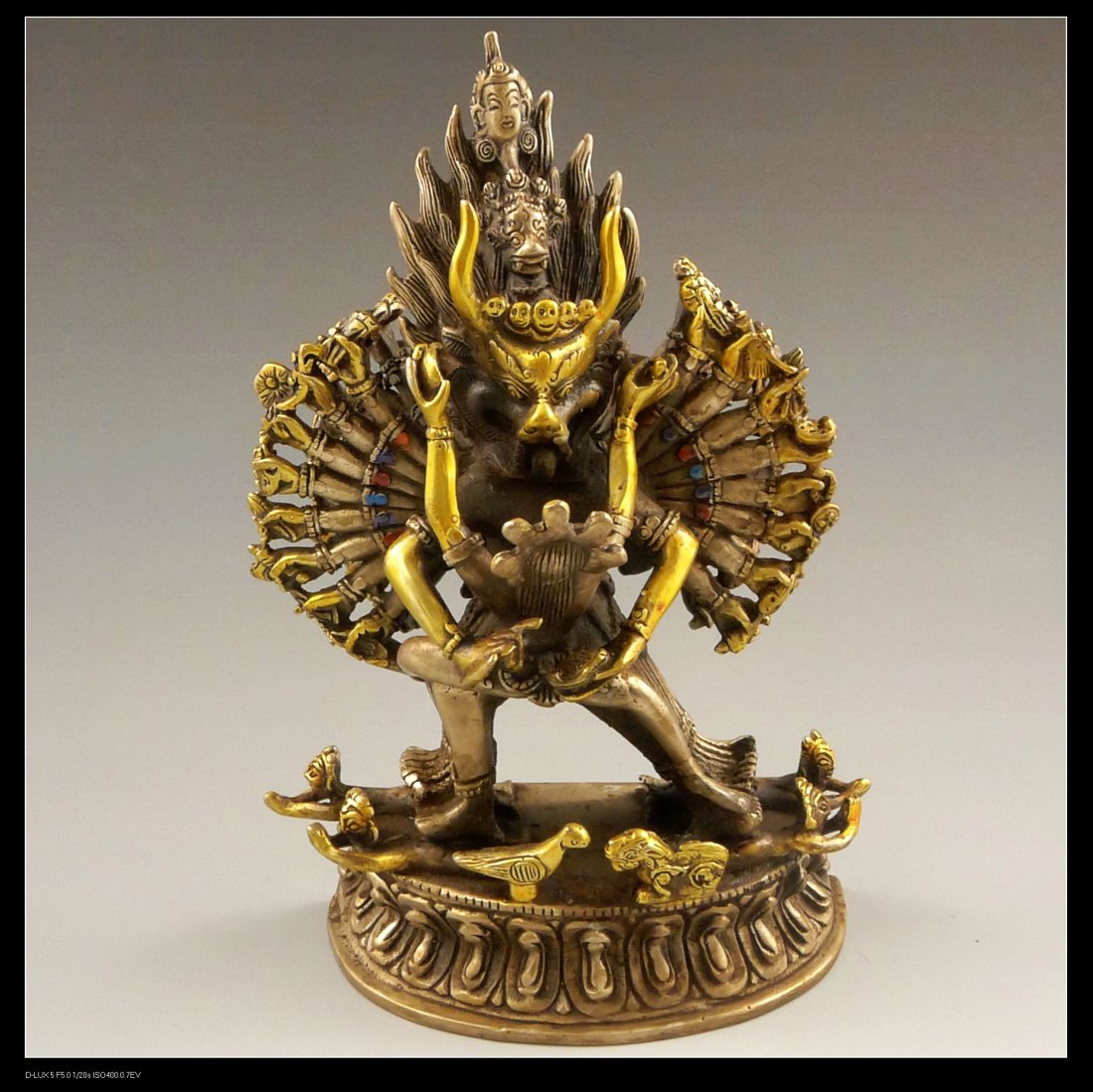 VINTAGE CHINESE GILT BRONZE TANTRIC GROUP: Well cast, vintage Chinese gilt bronze multi-armed Buddhist deity. H:7.5"