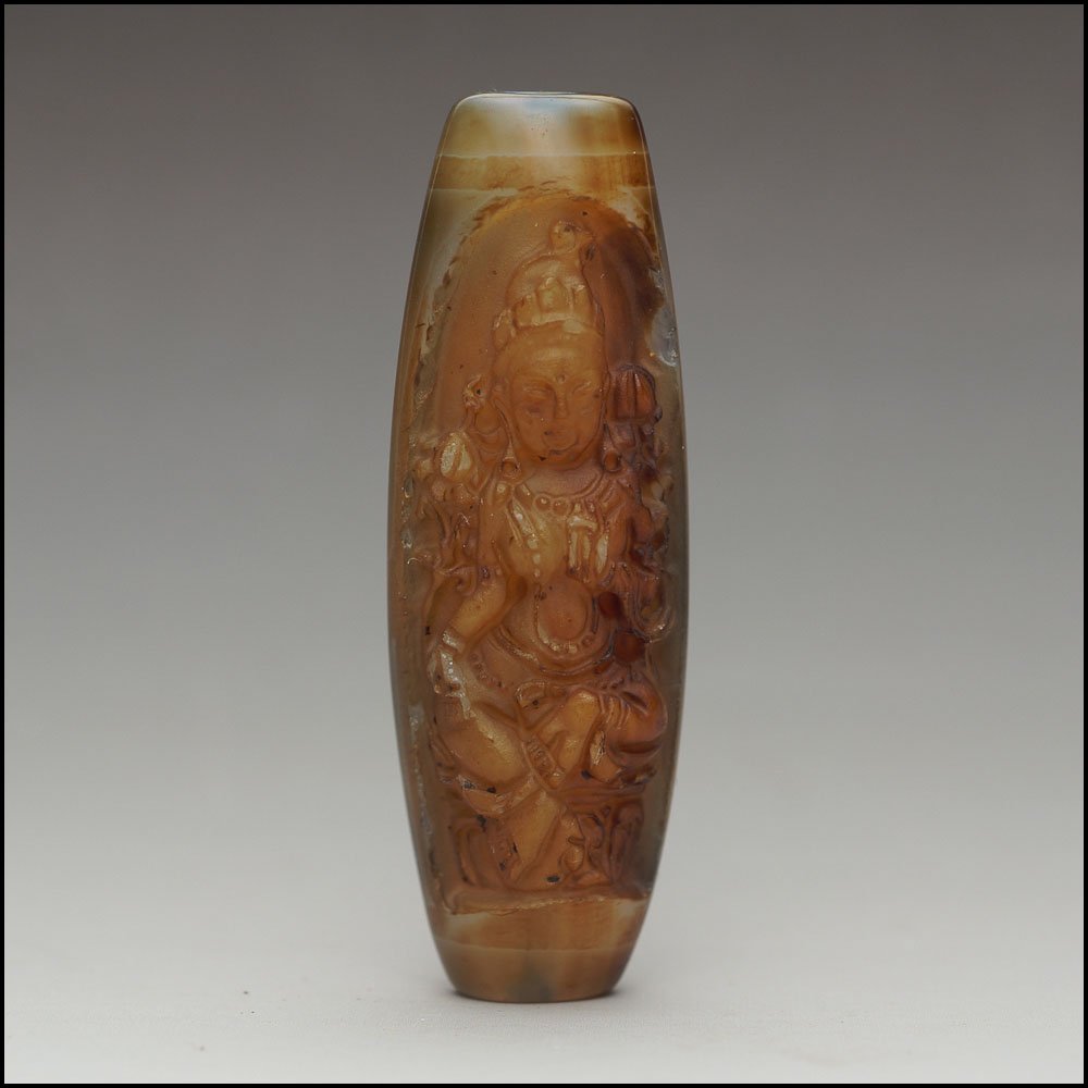 Rare Tibet Buddhist carving beads: Rare Tibet Buddhist carving beads; buddha image on the front side，and a beautiful circle pattern on the back side;size:2x0.55"