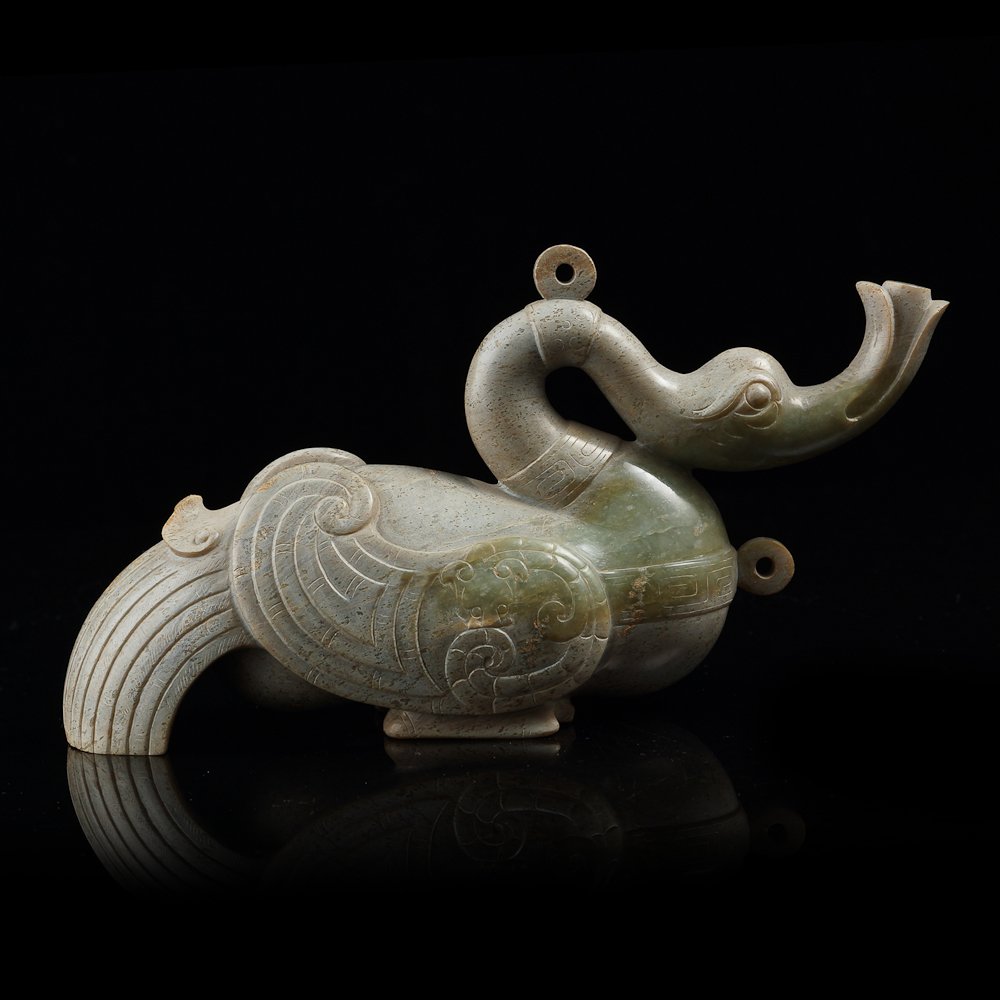 Chinese green jade bird from Han dynasty: Chinese green jade sculpture with a bird sharp. There are so many beautiful details on it. This sculpture is from Han dynasty. Measurement: 19 x 10 x 6cm, 779g. (approximately).