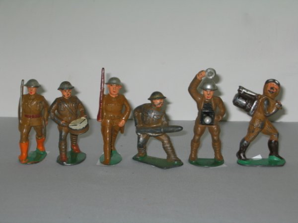 MANOIL LEAD TOY SOLDIERS, 6 TOTAL: MANOIL LEAD TOY SOLDIERS, 6 TOTAL. (1) OFFICER MARCHING WITH SWORD, M10,#9. (2) DRUMMER, M14,#11. (3) SOLDIER WITH MISSLE, M42,#24,ALMOST ALL PAINT IS WORN OFF. (4) SOLDIER MARCHING WITH RIFLE, M8,#8.