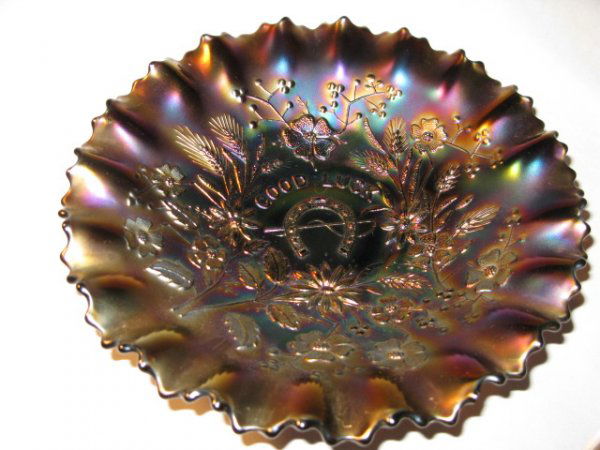 CARNIVAL NORTHWOOD "GOOD LUCK" BOWL, AMETHYST: CARNIVAL NORTHWOOD "GOOD LUCK" BOWL, AMETHYST. DEEP IRRIDESCENT AMETHYST COLORS ADORN THIS LOVELY BOWL. APP. 9"DIA. VGC