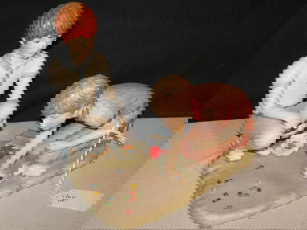 CYBIS "RUSTY & JONNY, BOYS PLAYING MARBLES": CYBIS FIGURE, RUSTY & JONNY, BOYS PLAYING MARBLES. APP. 7"Wx7"H. RECEIPT SHOWS $365.00. EC