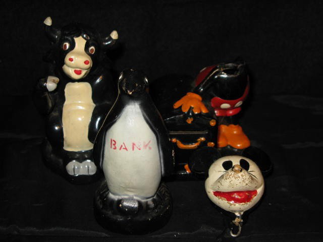 3 STILL BANKS,CROWN TOY CO: PENGUIN, FERDIND/MICKEY: (3) STILL BANKS. (1) PENGUIN ON BASE, COMP. 4 3/4", CROWN TOY CO., USA. (2) "FERDINAND", COMP. 5 1/8", CROWN TOY CO.-W. DISNEY ENT. , 1938. (3) "MICKEY MOUSE", MOVEABLE HEAD IS DETACHED FROM BASE, COM