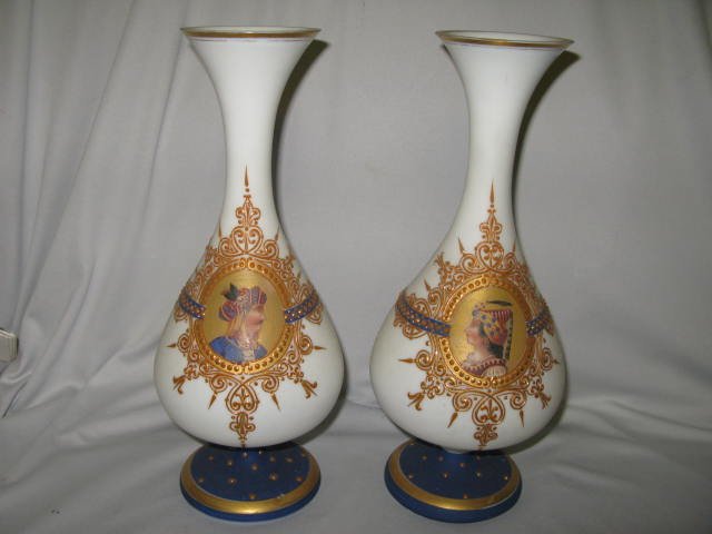 PR. VASES W/ARBIAN SULTAN & SULTANA: PR. VASES W/ARABIAN SULTAN AND SULTANA. HAND-PAINTED, RAISED AND ENAMELED PAINT. GOLD, COBALT OVER FROSTED WHITE. VERY DETAILED WITH BEAUTIFUL PORTRAIT ARTWORK. APP., 12"H EACH. VGC