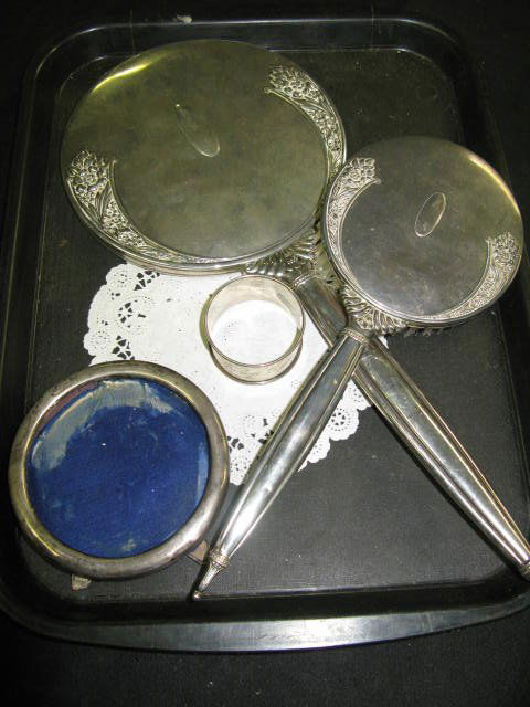 STERLING DRESSER PIECES FOR SCRAP, PLUS: STERLING DRESSER PIECES FOR SCRAP. INCLUDES HAND MIRROR, BRUSH, NAPKIN RING, SMALL ROUND STERLING FRAME. FOR SCRAP