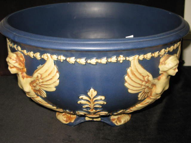 LG. WELLER BLUE FLEUR DE LIS BOWL W/ANGELS: LG. WELLER BLUE FLEUR DE LIS BOWL W/ANGELS. APP. THE INTERIOR HAS SOME WATER STAINS FROM A PLANT. THERE ARE NO CHIPS, CRACKS OF ANY SORT. OTHER THAN THE WATER STAINS, THE BOWL IS IN VGC.