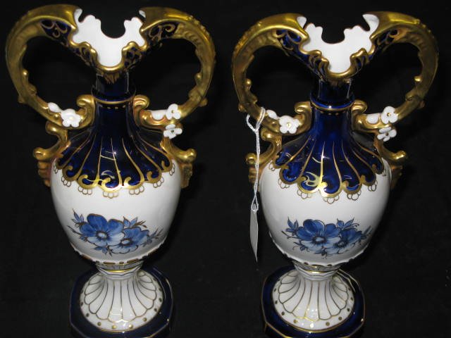 PR. ROYAL DUX VASES, COBALT & GOLD, 11 1/4"H: PR. ROYAL DUX VASES, COBALT & GOLD. SIMPLY BEAUTIFUL VAES W/HEAVY GOLD PAINT AT IDE HANDLES, PLUS THE COBALT IS LINED WITH GOLD. APP. 11 1/4"H. THERE IS NO CRAZING, CRACKS, DISCOLORATION OF ANY SORT. 
