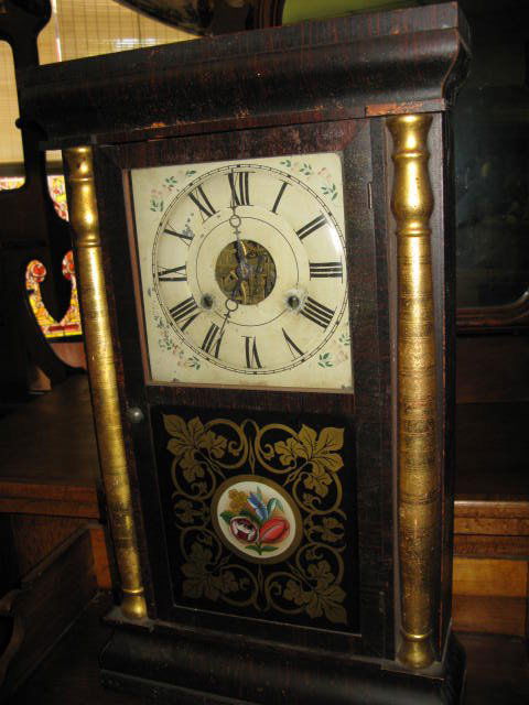 SETH THOMAS SHELF CLOCK. REVERSE PTD. DOOR: SETH THOMAS SHELF CLOCK. REVERSE PTD. DOOR. MADE IN PLYMOUTH HOLLOW, CONN. CLOCK IS NOT WORKING. APP. 25"Hx15"W.