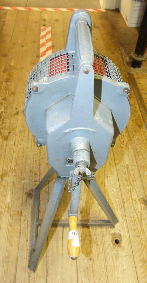 A Carter hand cranked air raid siren, on a steel base,