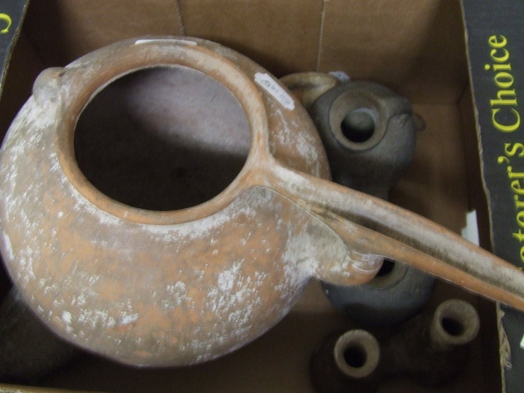 An earthenware figure, 26 cm high, and similar ceramics: An earthenware figure, 26 cm high, and similar ceramics (a.f.) (5)