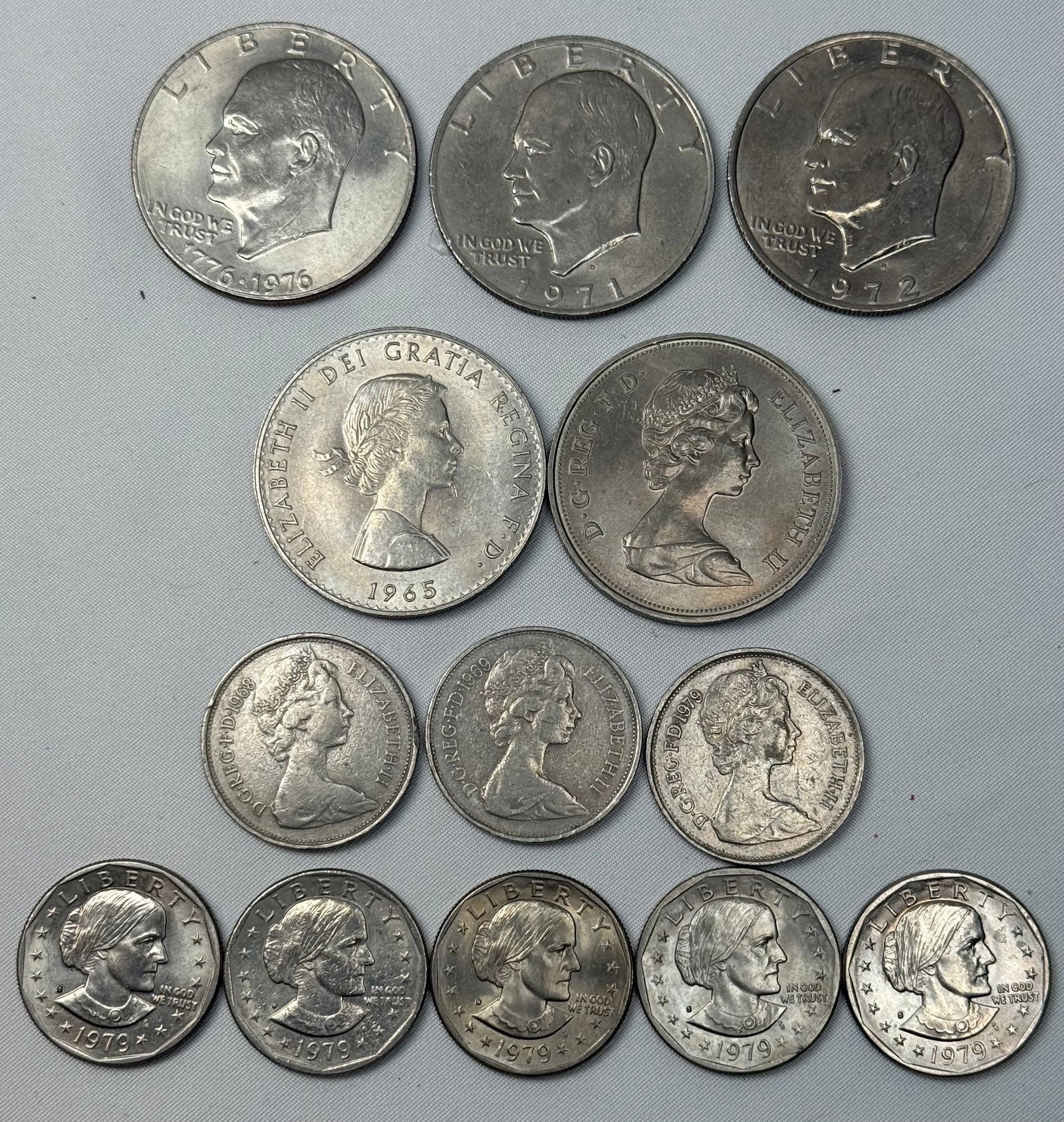 Mixed U.S. & U.K. Coin Lot – Eisenhower Dollars, 1979 SBA Dollars, Churchill Crown, British Pence (1 of 4)