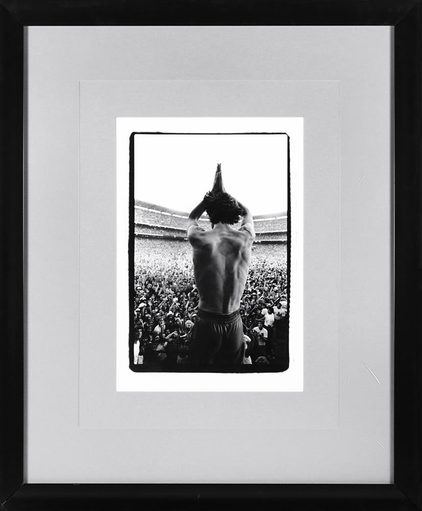 Mick Jagger “The Back” Concert Photograph, Framed, Hard Rock Hotel Las Vegas: Featured here is an authentic and original photograph titled “The Back,” depicting Mick Jagger from behind, poised before a massive concert crowd. This striking and iconic image emphasizes sca
