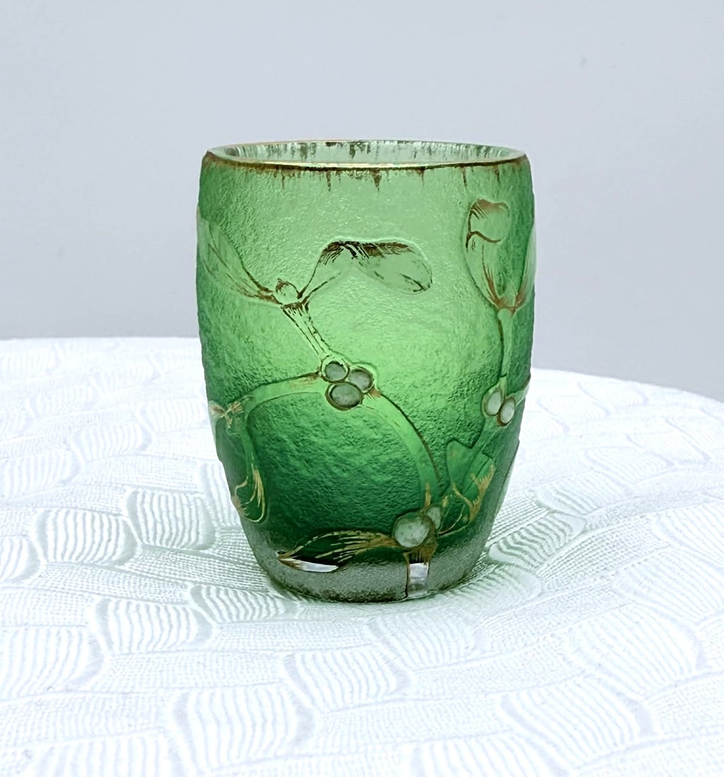 Daum Nancy Cameo Art Glass Tumbler, Green Gilded Floral Motif: This elegant Daum Nancy cameo art glass tumbler features a rich emerald-green ground with acid-etched floral and foliate decoration, highlighted by delicate gilt detailing. The design wraps continuous
