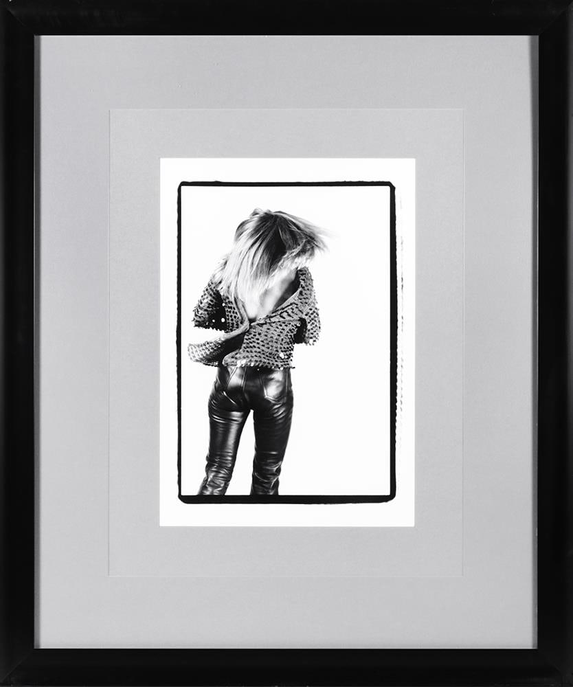Tina Turner The Back Concert Photograph, Framed, Hard Rock Hotel Las Vegas: Featured here is an authentic and original photograph titled “The Back,” depicting Tina Turner from behind, captured in a powerful and minimalist composition that emphasizes movement, strength