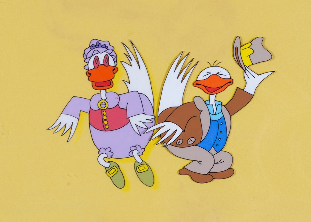 Original Sesame Street Animation Cels, Hand-Painted Production Artwork, ca. 1970s–1980s: Two original hand-painted animation cels from the television series Sesame Street, depicting whimsical bird characters in period costume against original yellow studio backgrounds. These cels were cre