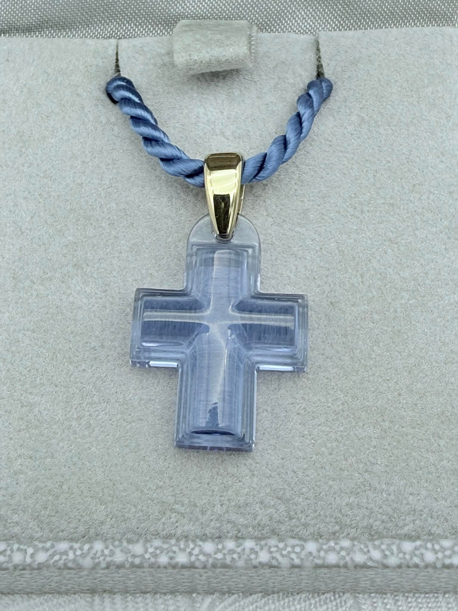 Lalique Crystal Cross Pendant Necklace, Blue France: Elegant Lalique crystal cross pendant necklace, inspired by René Lalique’s religious art motifs of the 1930s. This sculptural cross is executed in translucent colored crystal with softly curved edg
