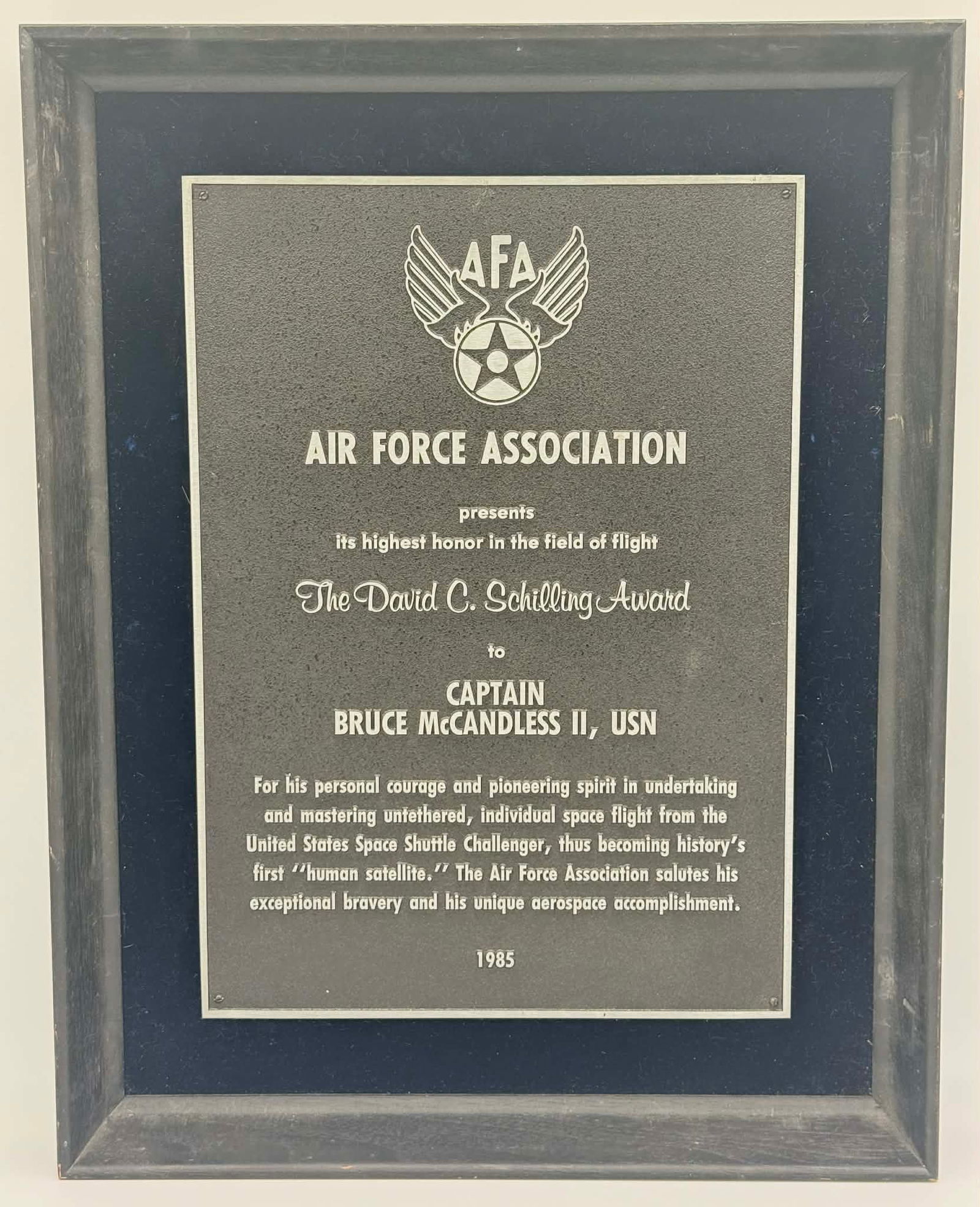 Bruce McCandless II NASA Collection – Air Force Association David C. Schilling Award Plaque (1985): Cast-metal Air Force Association presentation plaque awarding The David C. Schilling Award to Captain Bruce McCandless II, USN, dated 1985. The David C. Schilling Award is described by the Air Force A
