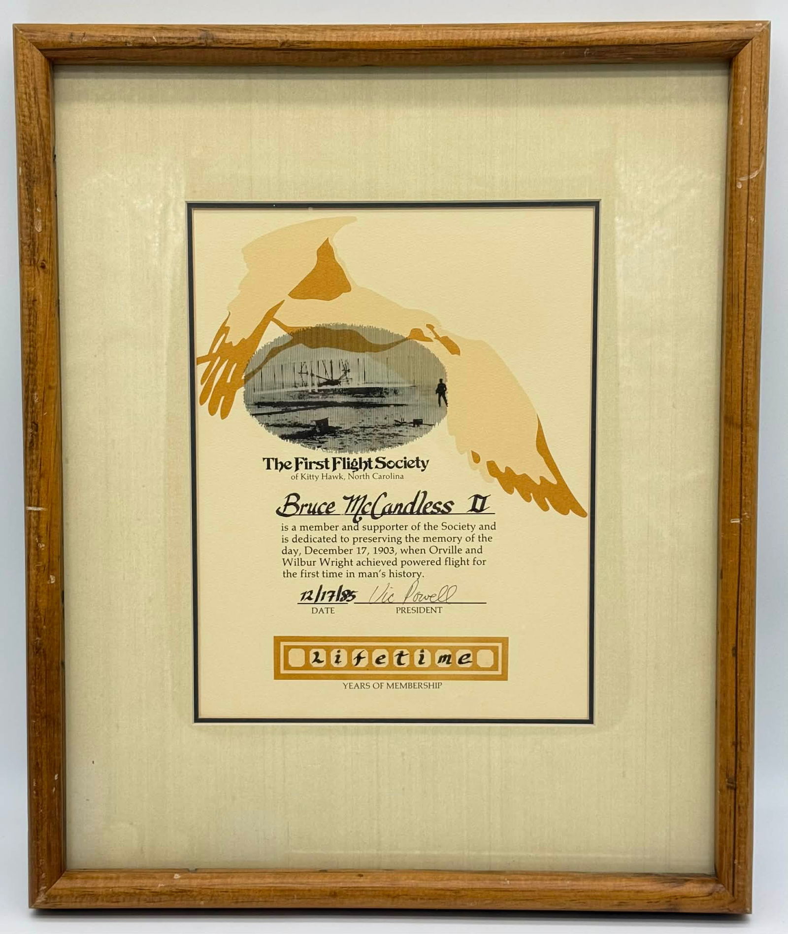 Bruce McCandless II First Flight Society Lifetime Membership Certificate (1985), Framed: Original framed Lifetime Membership certificate issued by The First Flight Society of Kitty Hawk, North Carolina, made out to famed astronaut Bruce McCandless II. Dated December 17, 1985, the document
