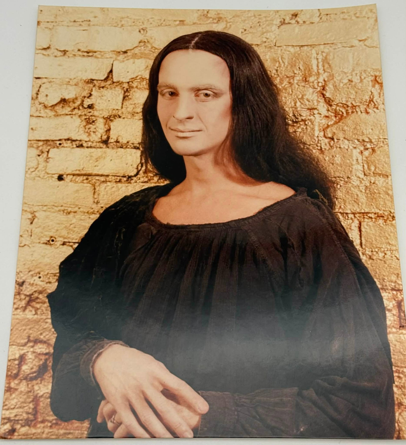Clayton Patterson “Drag Mona Lisa” Signed Photograph 8x10 NYC Portrait: Color photograph titled “Drag Mona Lisa” by Clayton Patterson, presenting a stylized portrait that reinterprets Leonardo da Vinci’s iconic composition through a contemporary drag lens. The s