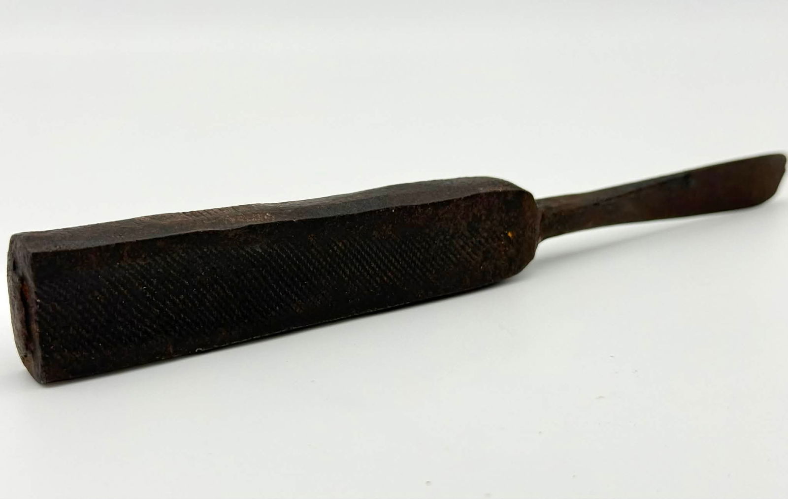 Antique Cast Iron Oyster Shucker / Oyster Knife Tool: Antique cast iron oyster shucker or oyster knife tool with a solid rectangular handle and tapered blade. The handle features a textured crosshatch grip for improved control, while the narrow blade is