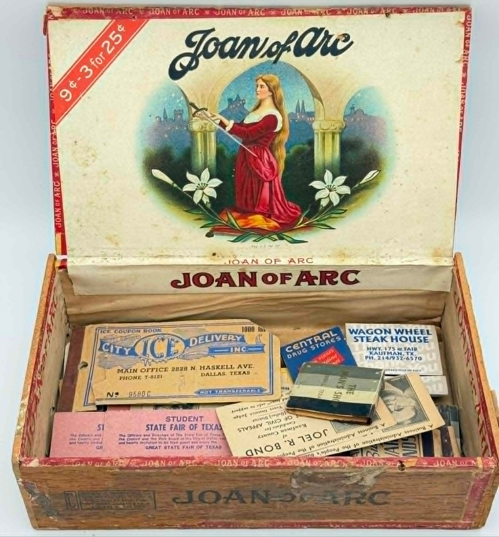 Vintage Joan of Arc Cigar Box w Ephemera Matchbooks Tickets Texas Advertising Lot: Vintage wooden cigar box branded “Joan of Arc,” retaining its original lithographed inner lid label featuring a portrait of Joan of Arc. The box contains a collection of assorted vintage ephem