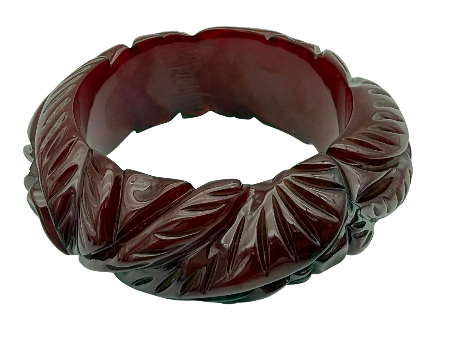 Rare Transparent Prystal Catalin (Bakelite) Bangle Bracelet – New York Studio, Warhol-Era: Rare Transparent Prystal Catalin (Bakelite) Bangle Bracelet - Vintage Catalin bangle bracelet from a New York studio collection, featuring a rich cherry-red tone and carved repeating leaf motifs.The b