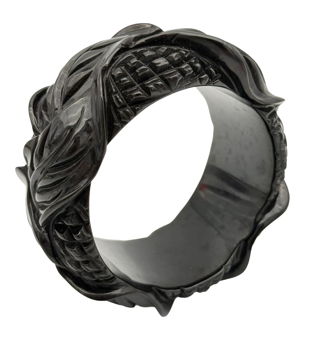 Deeply Carved Catalin Bangle Bracelet, Warhol-Era Provenance, 1930s–1940s – New York Studio: Exceptional deeply carved Catalin bangle bracelet dating to the 1930s–1940s, featuring a highly sculptural design combining bold foliate elements with inset basketweave-style panels. The carving is