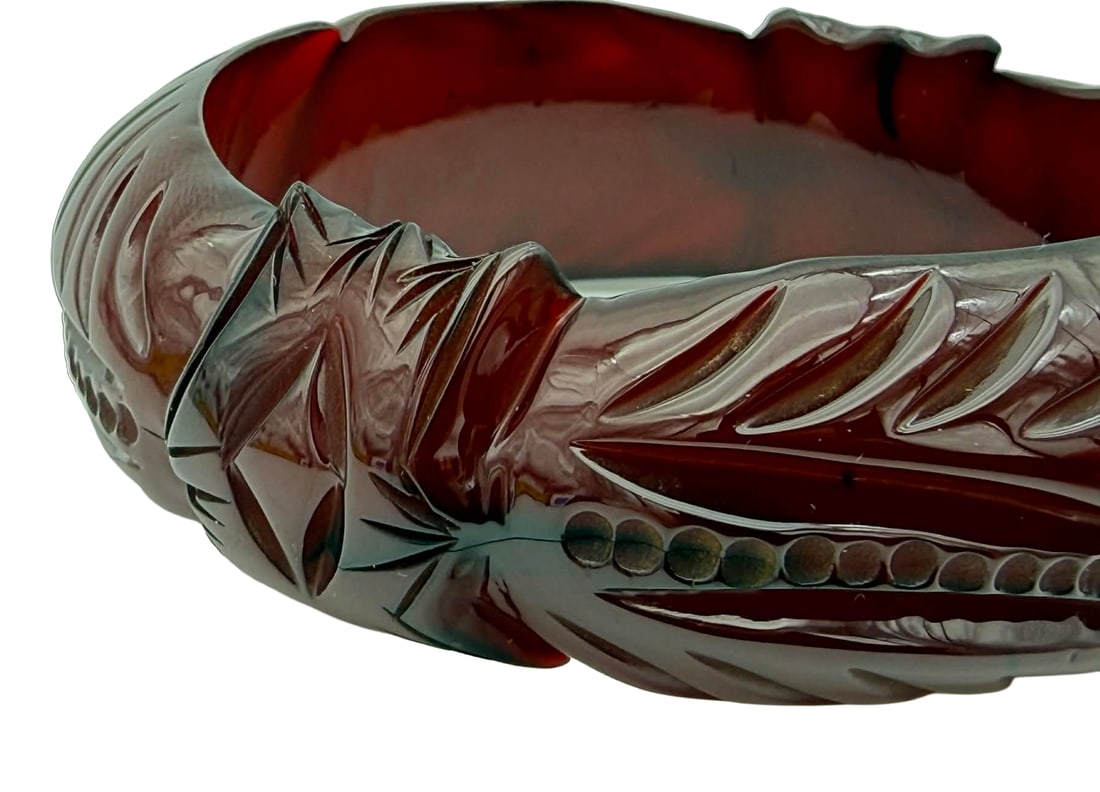 Carved Prystal Resin Bangle Bracelet, 1930s – New York Studio Collection: Vintage carved prystal resin bangle bracelet dating to the 1930s. This example features bold, deeply cut relief carving with alternating foliate and geometric motifs, creating a rhythmic, sculptural s