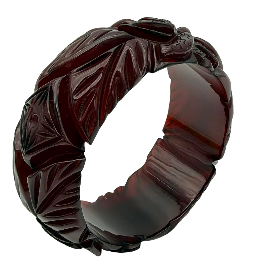 Deeply Carved Prystal Resin Bangle Bracelet with Dot Motif, 1930s – New York Studio Collection: Vintage deeply carved prystal resin bangle bracelet dating to the 1930s, featuring bold high-relief foliate carving with repeating geometric panels centered by a dot motif. The carving is crisp and di