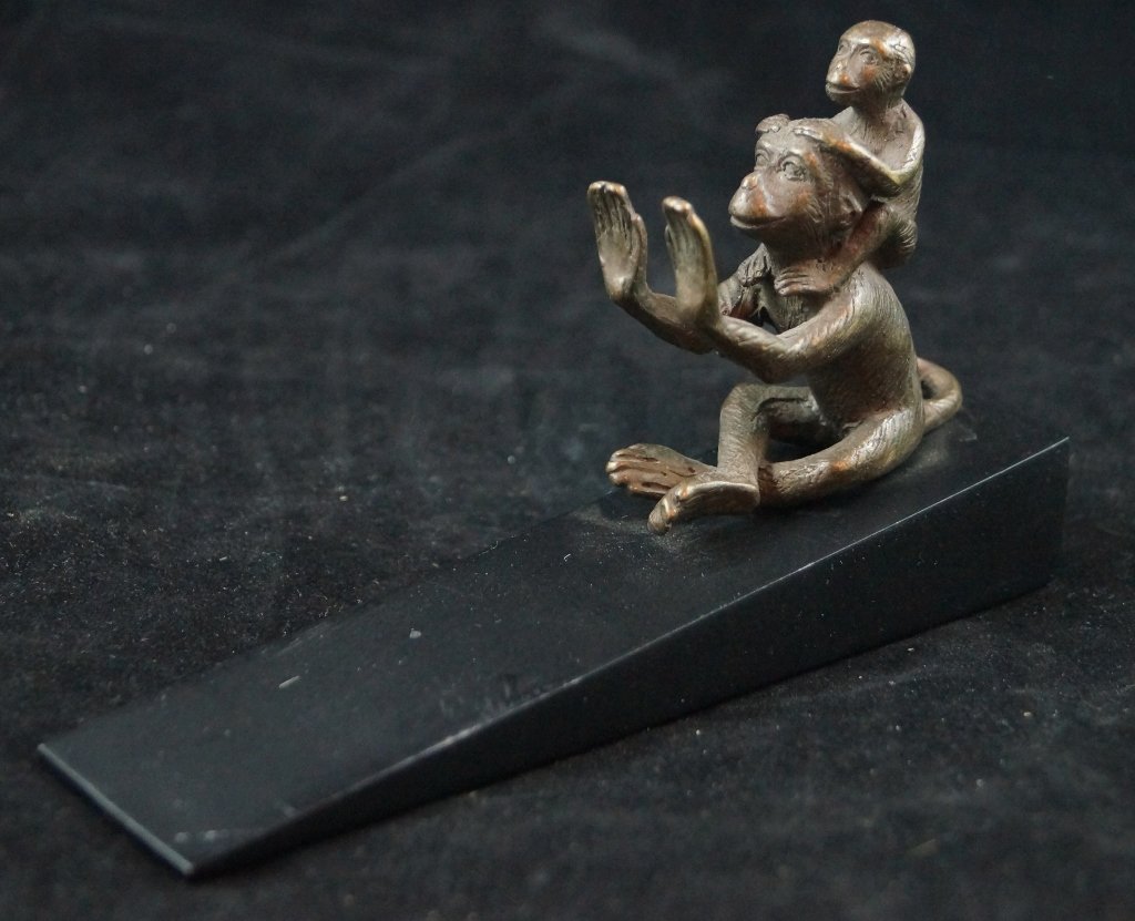 SPI Bronze Vintage Doorstop, Two Monkeys: Unique bronze monkey doorstop made by San Pacific International (SPI). Monkey's are bronze, base of doorstop is dark wood. Quality brass sculpture. About 6 1/2" inches long. 3 1/2" inches tall. Condit
