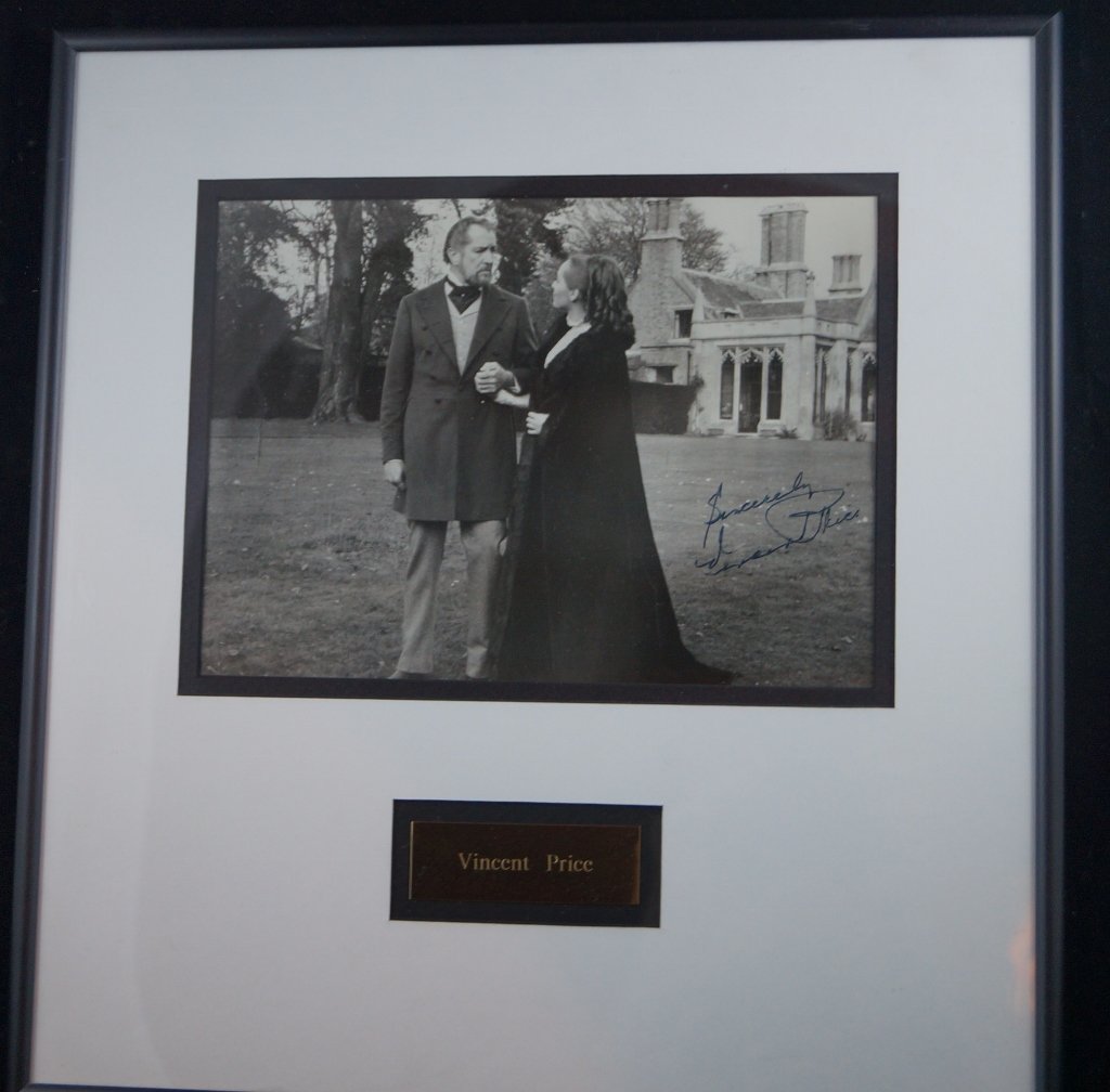 Signed Vincent Price Hollywood Actor Photo Display: Beautiful framed, matted photo display of actor Vincent Price. Hand signed on black and white photo. 13 1/2 x 14 1/2" inches and ready to hand. We believe the frame is plexiglass. No COA. Can't verify