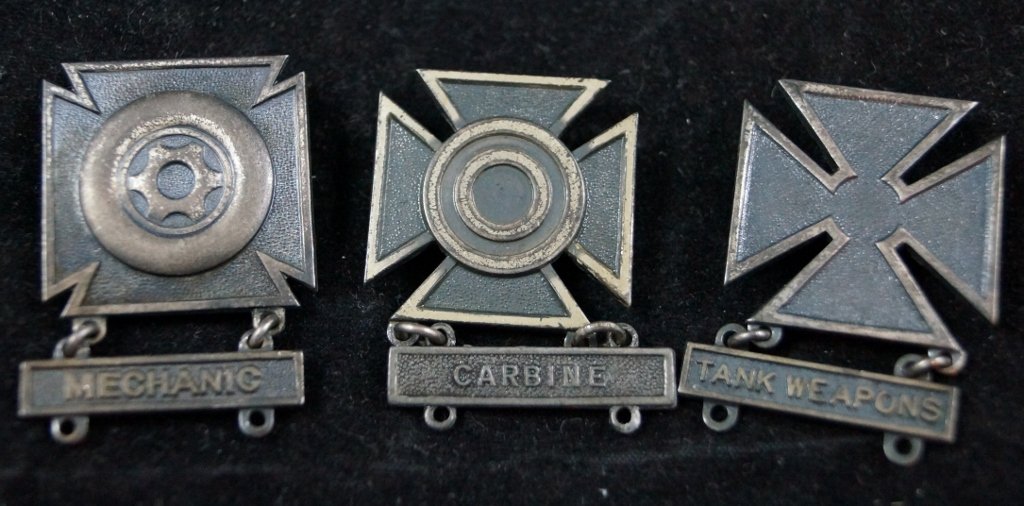 Sterling Silver U.S. Military Pins Badges LOT: Sterling Silver U.S. Military Pins Badges LOT of 3. Two are marked "Sterling". Tank Weapons, Mechanic and Carbine. Each one 1 1/4 x 1 1/2" inches. Some tarnish.