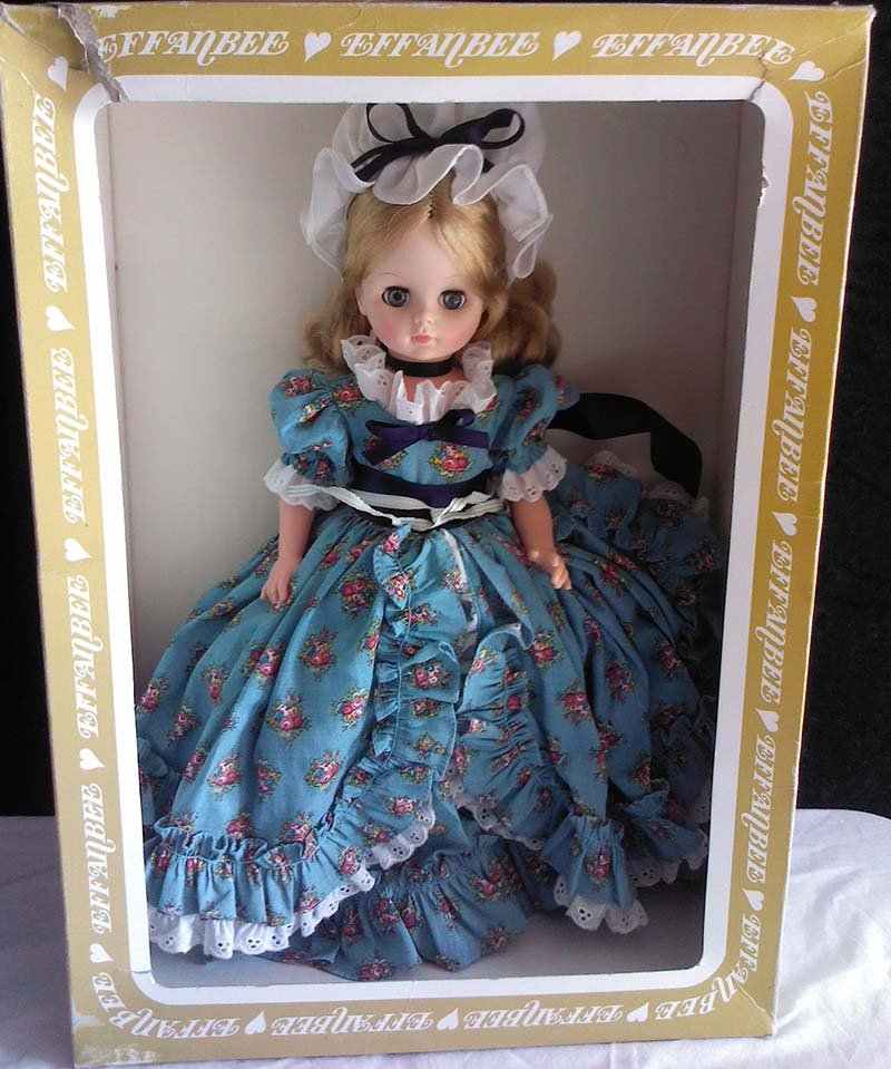 Vintage 1966 Effanbee Doll Original Prairie Dress: Original 1966 Effanbee Doll in original box. She stands about 13" inches tall in a blue dress and white hat (prairie style). Marked "Effanbee 1966" on her neck.Doll is in mint condition. Original box