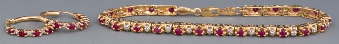 RUBY AND DIAMOND BRACELET & MATCHING EARRINGS: RUBY AND DIAMOND BRACELET & MATCHING EARRINGS 10k yellow gold bracelet featuring 21 deep red round rubies totaling approximately 2ct in total weight and 21 accent diamonds. Comes with matching pair of