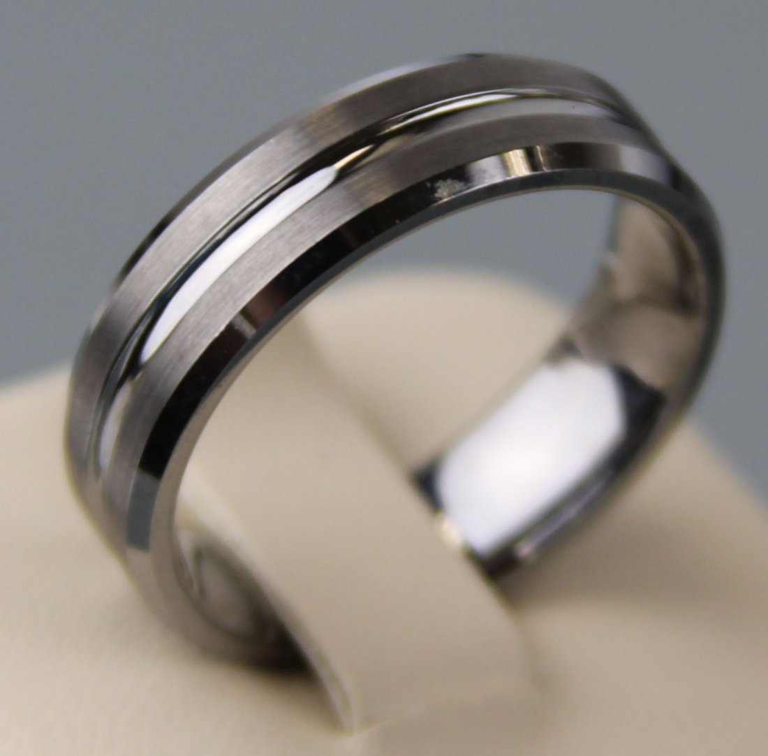 MENS 8MM TUNGSTEN WEDDING BAND W/ STRIPE IN CENTER: MENS 8MM TUNGSTEN WEDDING BAND W/ STRIPE IN CENTER 8MM mens tungsten wedding band with brushed finish and one stripe in center. Tungsten is extremely abrasion resistant and will hold it's finish for l