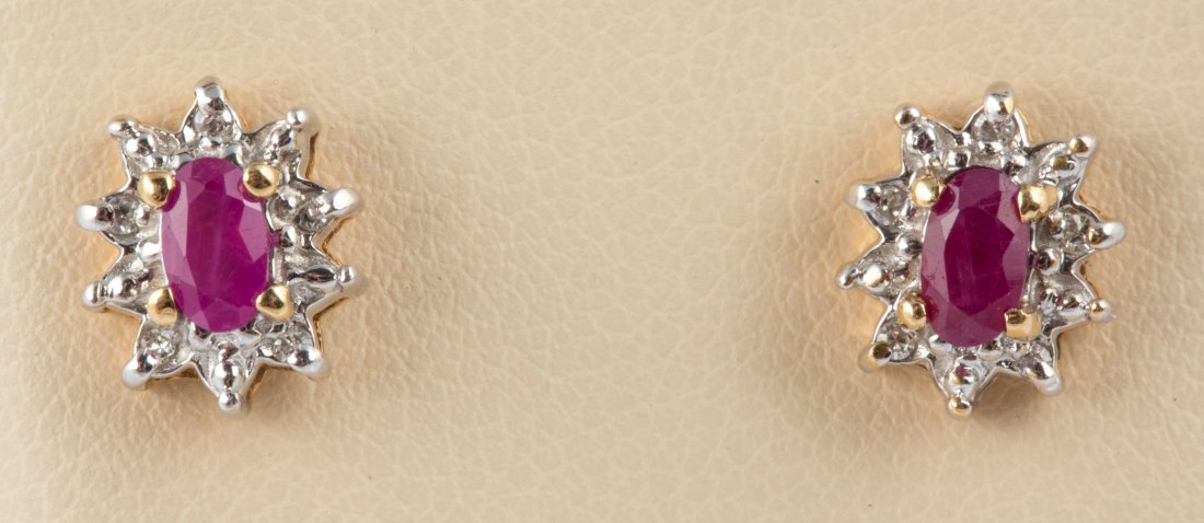 10K WHITE AND YELLOW GOLD RUBY EARRINGS: 10K WHITE AND YELLOW GOLD RUBY EARRINGS 10k yellow and white gold cluster earrings with 5 x 3 mm oval rubies, .05 ct total. Deep red color, I2 clarity. Weight: 1.8 g