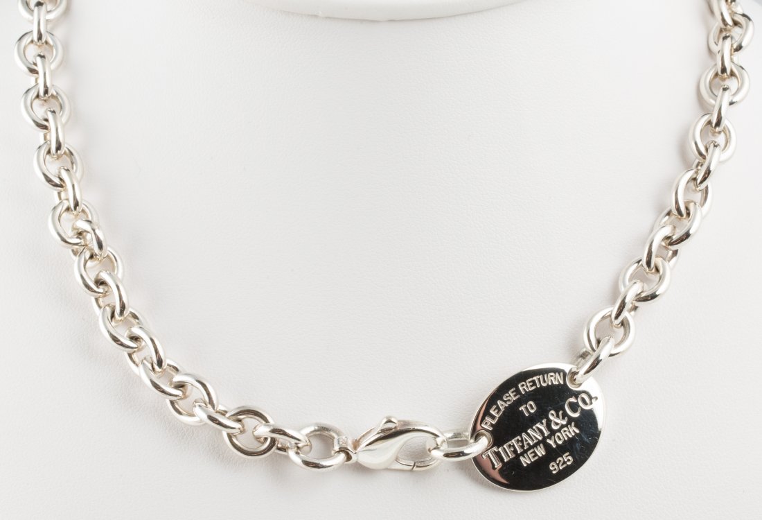 RETURN TO TIFFANY & CO STERLING SILVER NECKLACE: RETURN TO TIFFANY & CO STERLING SILVER NECKLACE Circle link Tiffany & Co necklace with "Please Return To Tiffany & Co. New York 925" tag and lobster claw clasp. Weight: 52.6g Size: 15.5in