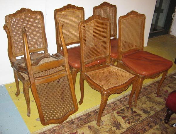 DINING CHAIRS, a set of six, 19th century French: DINING CHAIRS, a set of six, 19th century French provincial beechwood with caned backs, seats and brown leather squab cushions on cabriole legs. (6) (af, damage to one leg and seat)