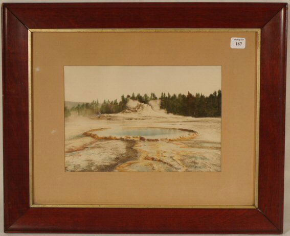 F.J. Haynes - Untitled Yellowstone Park: Circa 1900-10 F. J. Haynes hand-colored photo. Steaming hot springs scene. Wyoming. Original overmat and impressed signature. Est 16x14" frame with no backing paper. 4.0 Grading with good image color;
