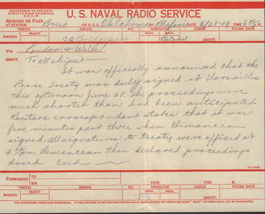 WWI ship correspondence: 6.5x8 US Naval Radio Service correspondence between the Bridgeport and the Oklahoma from June 28, 1919, communicating the signing of the peace treaty