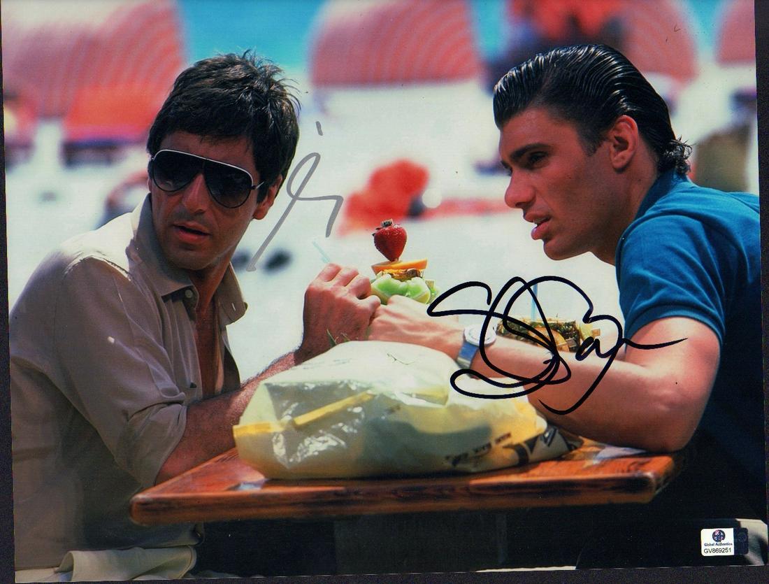 Al Pacino and Steven Bauer Scarface signed 11x14: A color scene from Scarface signed 11x14 by both stars Al Pacino and Steven Bauer with Global Authentics sticker